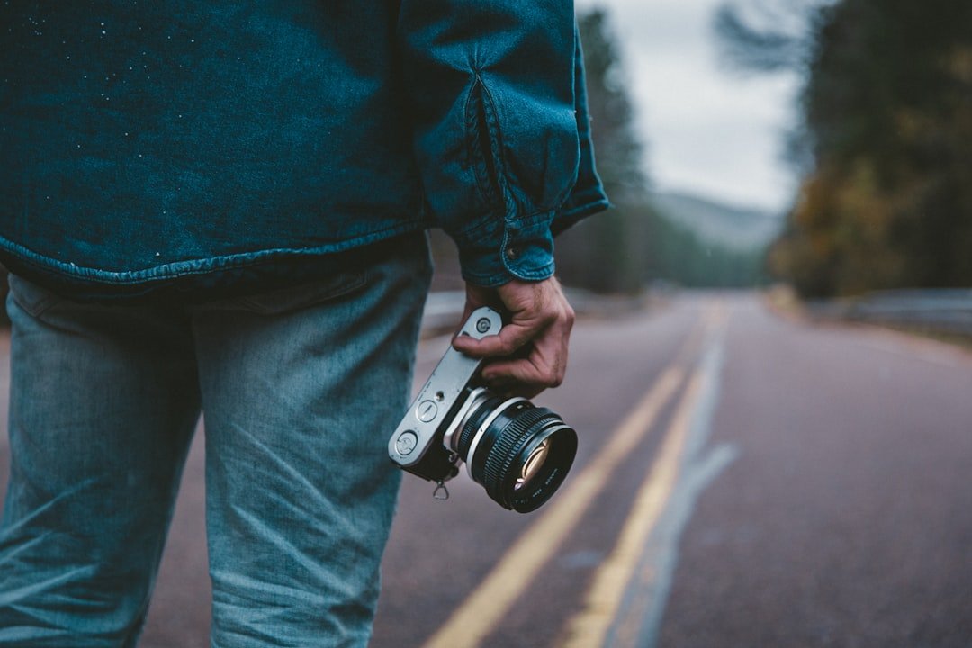 Photographer with camera capturing images for stock photography passive income